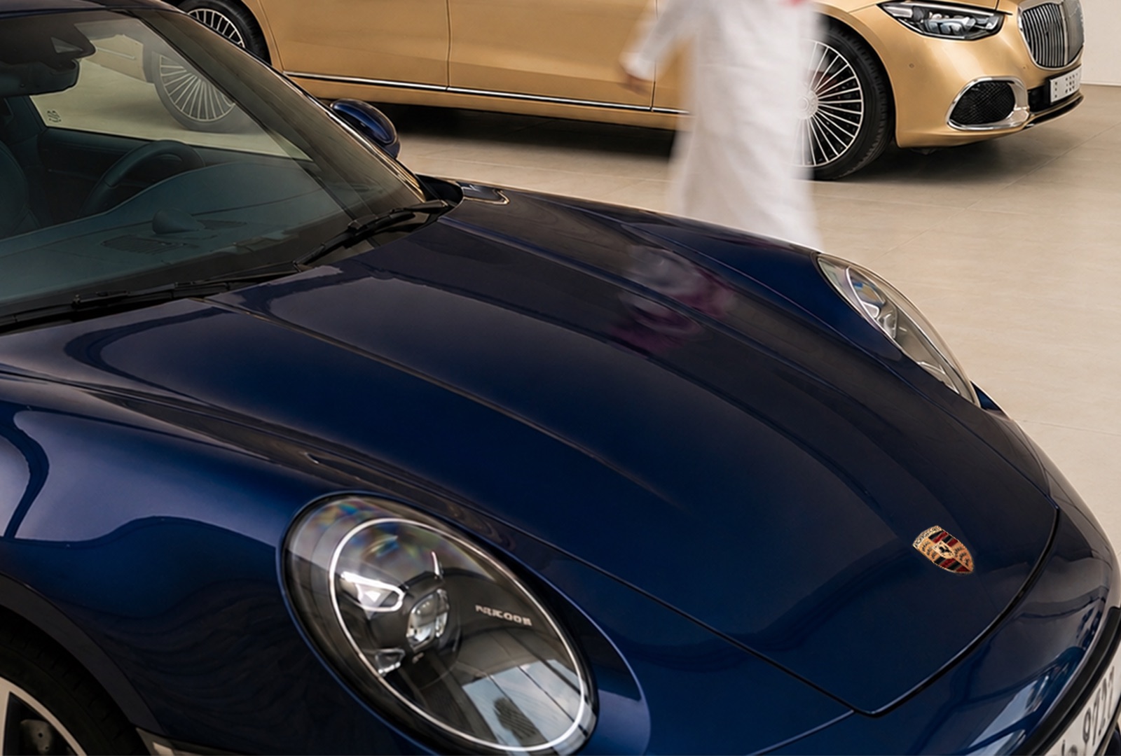 A blue Porsche and a gold Maybach — the cars you already own and love